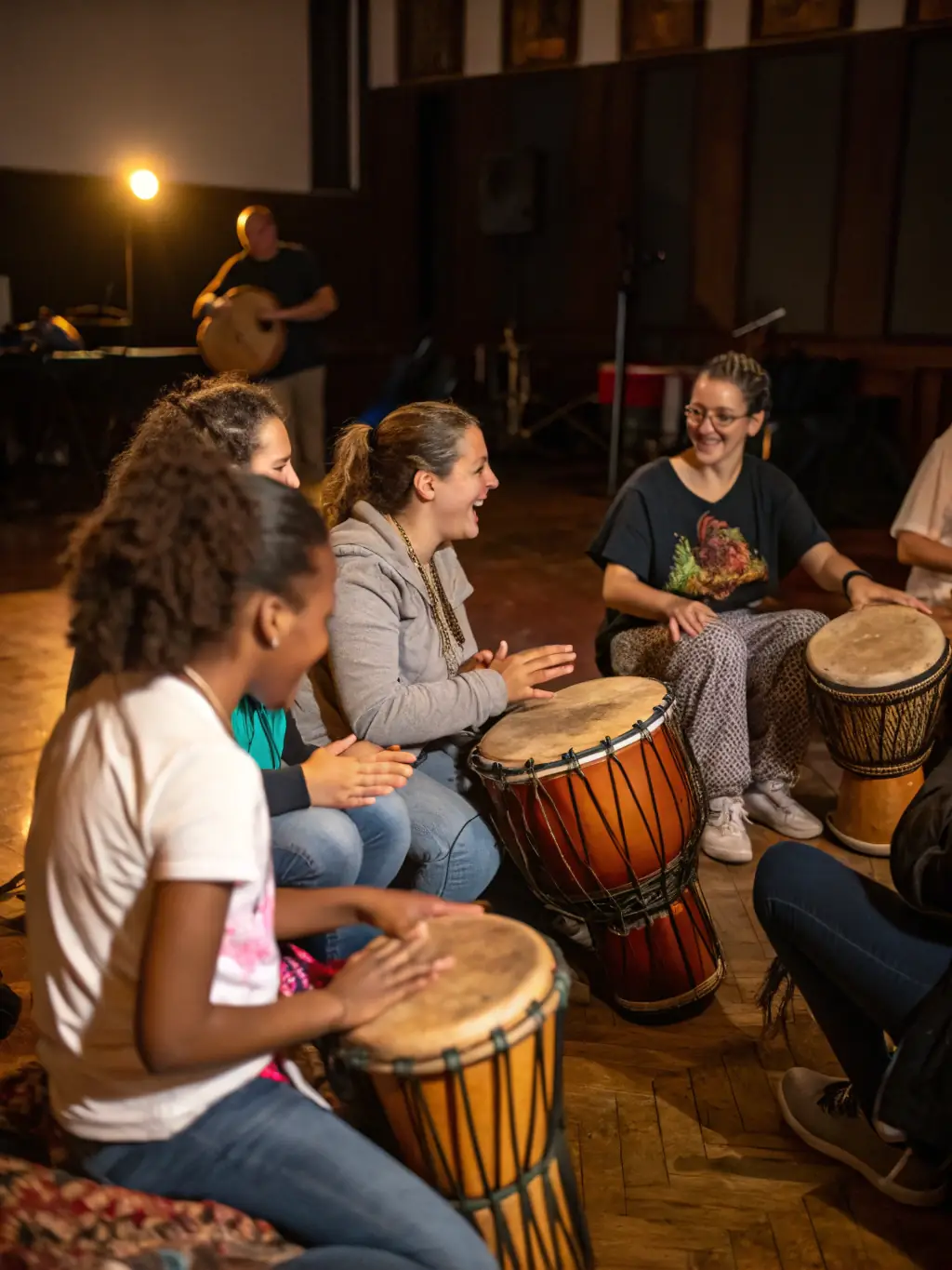 A photograph capturing a diverse group of musicians participating in a collaborative music workshop at LE SERPENT A PLUME, showcasing various instruments and engaged expressions.